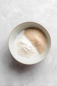 Mix flour, granulated sugar, brown sugar, baking soda, and salt together