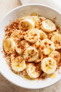 Mix sliced bananas with honey and cinnamon