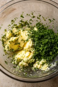 Mix softened butter with minced garlic and chopped parsley