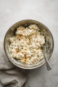 Mix the tuna, mayonnaise, mustard, and shredded cheese in a bowl