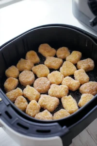 Place frozen alphabet nuggets in air fryer