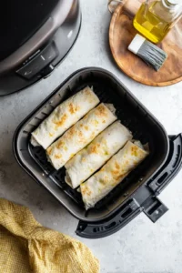 Place frozen breakfast burritos in a single layer in the air fryer