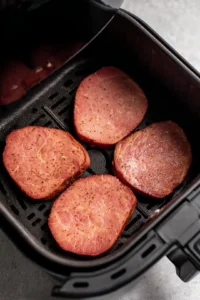 Place ham steaks in air fryer