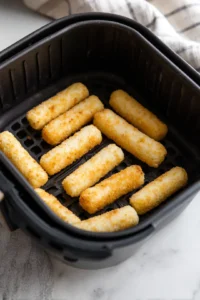 Place mozzarella sticks in a single layer in the air fryer