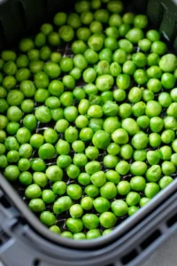 Place peas in air fryer in a single layer