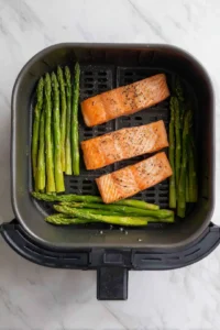 Place salmon and asparagus in air fryer