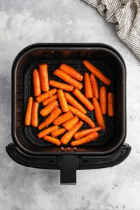 Place seasoned carrots in air fryer