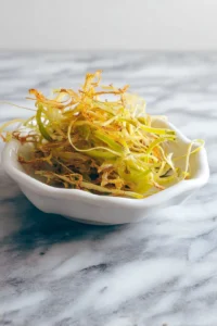 Place seasoned leeks in the air fryer basket and cook