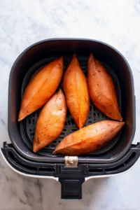 Place sweet potatoes in air fryer and cook until tender