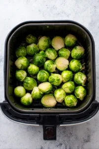 Place the Brussels sprouts in a single layer in the air fryer basket