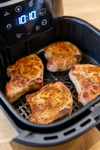 Place the pork chops in the air fryer