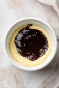 Pour the batter into greased ramekins and place them in the preheated air fryer