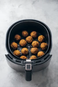 Preheat air fryer to 375 degrees Fahrenheit and cook stuffing balls