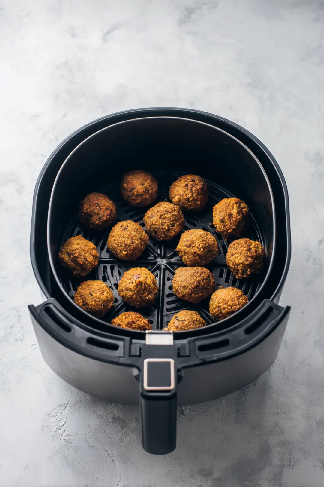 Preheat air fryer to 375 degrees Fahrenheit and cook stuffing balls