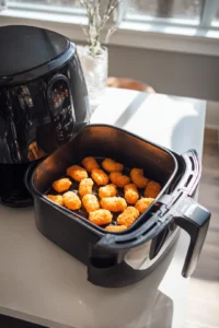 Preheat air fryer to 375°F and place the coated mac and cheese bites
