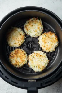 Preheat the air fryer and shape the latkes