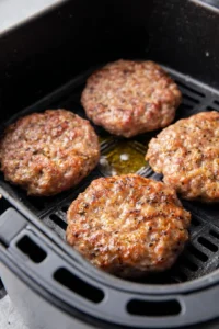 Preheat the air fryer to 360 degrees Fahrenheit and cook the burger patties