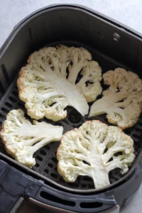 Preheat the air fryer to 400°F (200°C) and prepare the cauliflower steaks