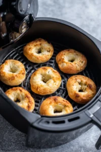 Preheat your air fryer to 350 degrees Fahrenheit and cook bagels