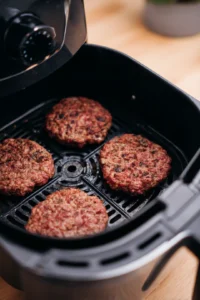 Preheat your air fryer to 350°F (175°C) and cook slider patties for 5 minutes