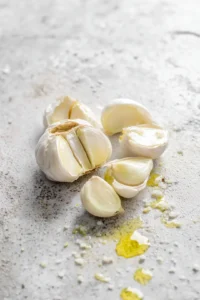 Slice the top off the head of garlic to expose the cloves and drizzle it with olive oil and salt