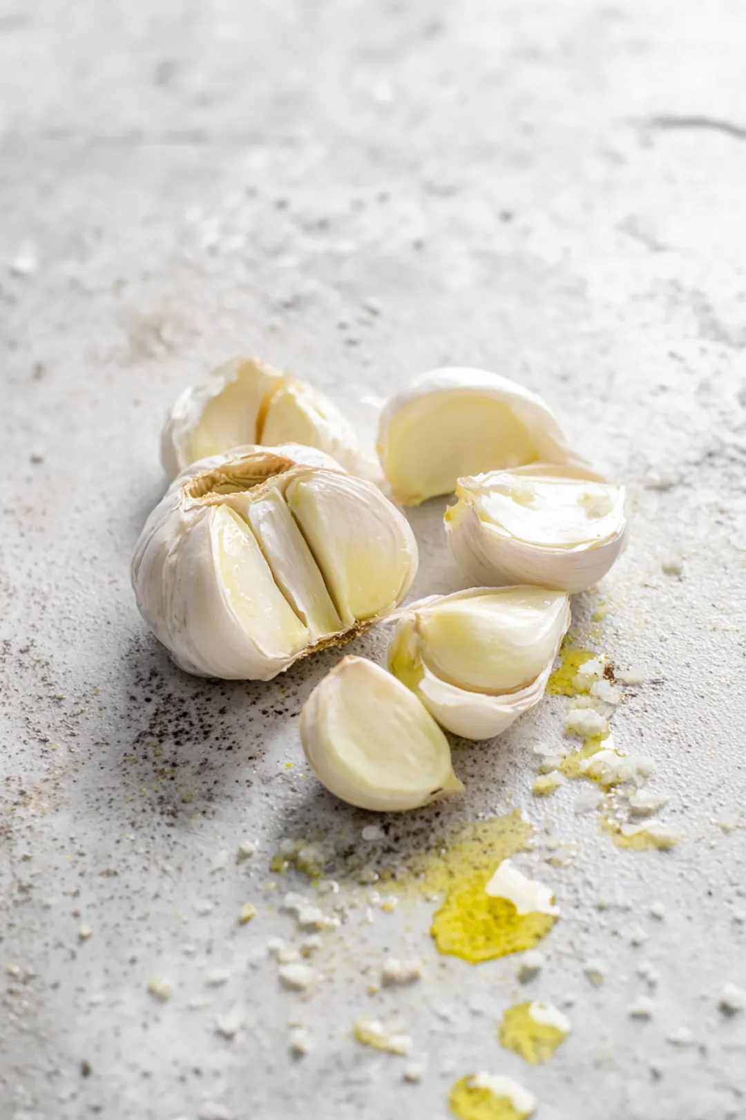 Slice the top off the head of garlic to expose the cloves and drizzle it with olive oil and salt