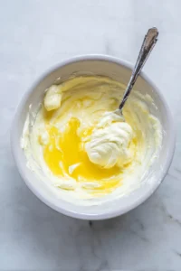 Spoon the yolk mixture back into the egg whites and smooth out the tops