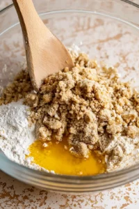 Spread crumbly topping over peach mixture and air fry