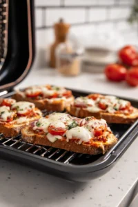 Top each slice with your favorite toppings then air fry for 7 minutes or until the cheese is bubbly and golden brown