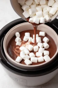 Top the mixture with vegan marshmallows and air fry until golden