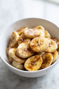 Toss banana slices with olive oil and sprinkle with cinnamon