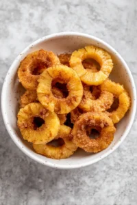 Toss pineapple rings with brown sugar and cinnamon