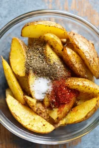 Toss potato wedges with olive oil and seasonings