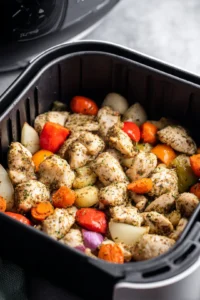 Transfer the mixture to the air fryer basket and arrange in a single layer for cooking