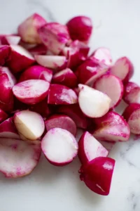 Wash and trim radishes, cutting them in halves or quarters for even cooking