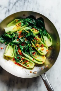 Add bok choy and red chili flakes and sauté until tender