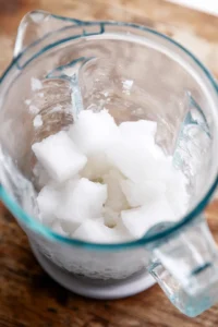 Add ice cubes to the blender