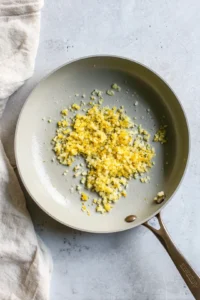 Add minced garlic and sauté until fragrant