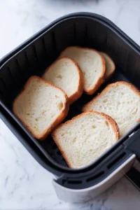Arrange bread slices in air fryer