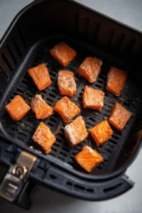 Arrange salmon bites in air fryer