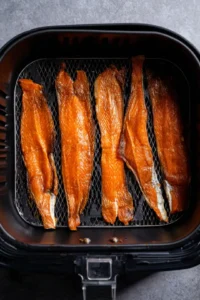 Arrange salmon skins in air fryer