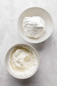 Beat the egg whites and cream of tartar until stiff peaks form