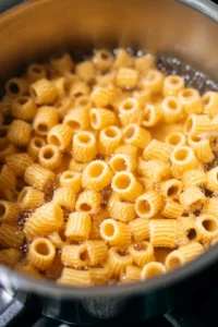 Boil honeycomb pasta in salted water until al dente