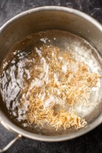 Boil water and cook Buldak ramen noodles