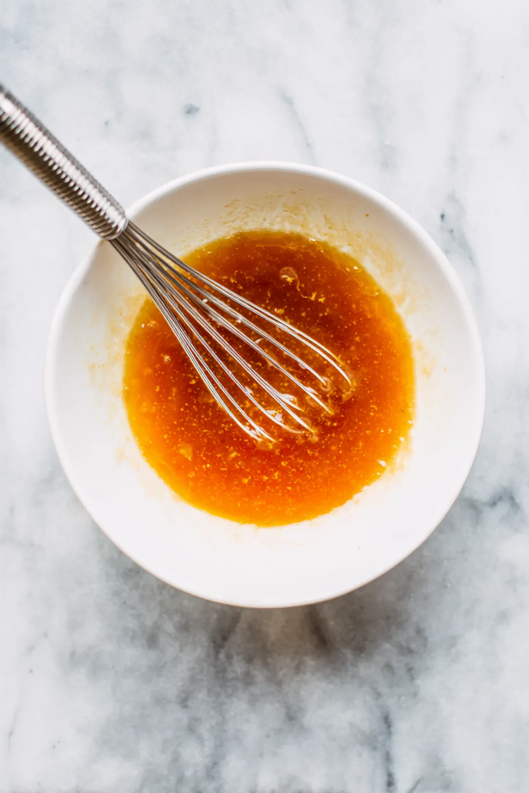 Combine apricot preserves, honey mustard, and soy sauce in a mixing bowl and mix well