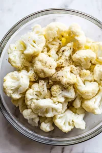 Combine cauliflower florets with olive oil and seasonings