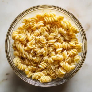 Combine cooked pasta with olive oil and truffle salt