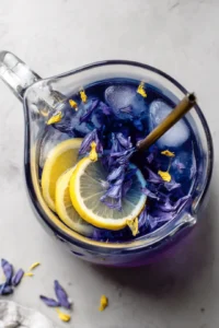 Combine cooled butterfly pea tea, fresh lemon juice, and honey or agave syrup