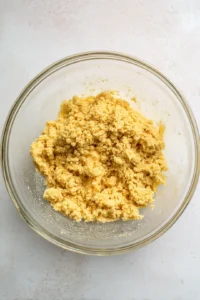 Combine crushed biscuits with melted butter and press into the bottom of serving jars