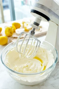 Combine feta cheese, cream cheese, olive oil, and lemon juice until smooth